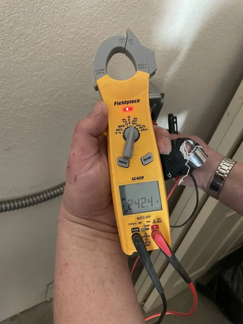 Voltage testing with clamp meter during Ceiling Fan Installation in Upton
